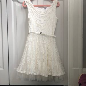 White belted lace dress with ruffled hem